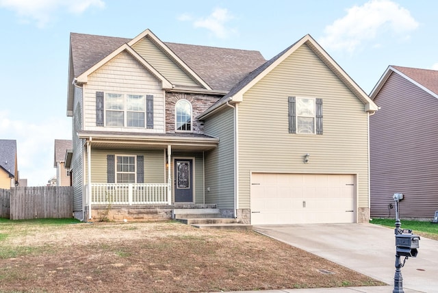 view of front of house featuring a porch and a garage