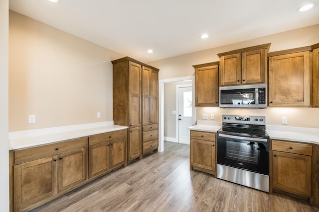 kitchen featuring light wood-type flooring and stainless steel appliances