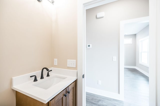 bathroom featuring vanity and wood-type flooring