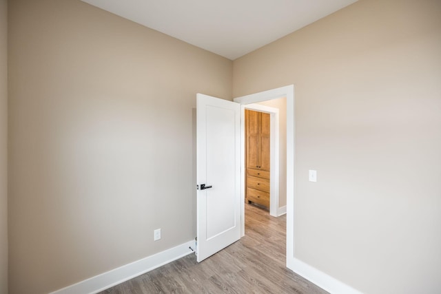 spare room featuring light hardwood / wood-style floors