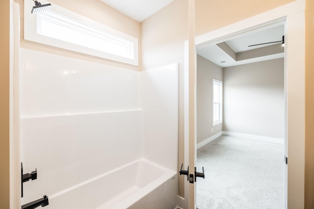 bathroom with shower / bath combination and ceiling fan