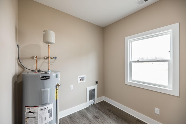 clothes washing area featuring hookup for an electric dryer, washer hookup, electric water heater, and dark hardwood / wood-style floors