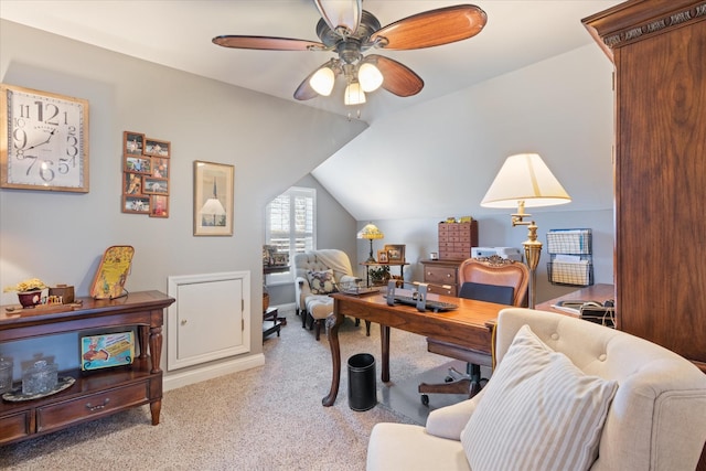 carpeted office space featuring ceiling fan and vaulted ceiling