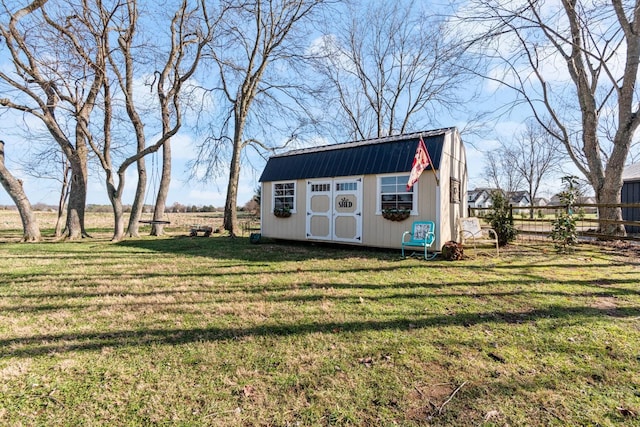 view of outdoor structure featuring a yard