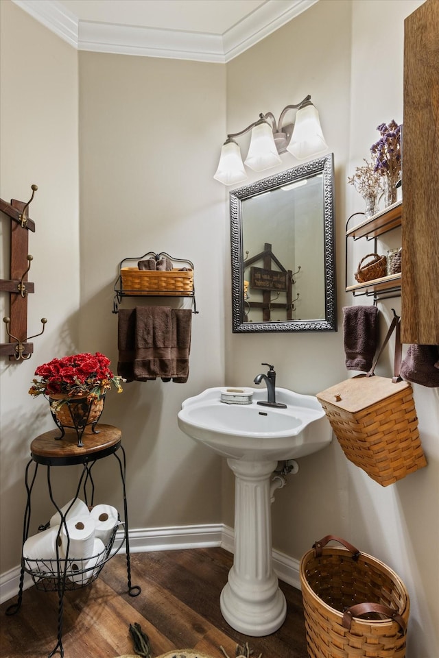 bathroom with hardwood / wood-style floors and crown molding