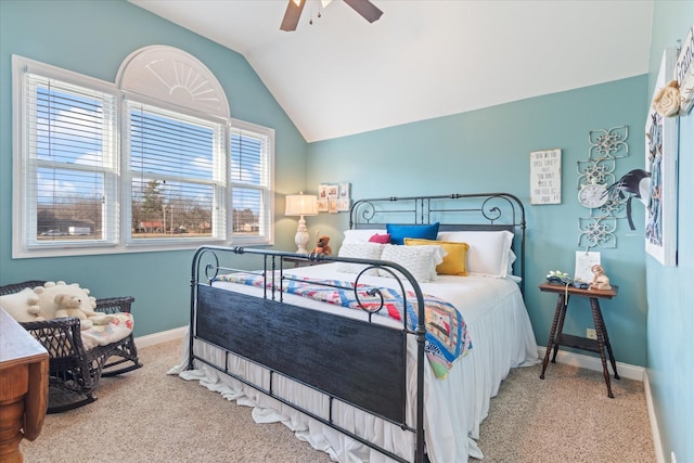 carpeted bedroom with multiple windows, vaulted ceiling, and ceiling fan