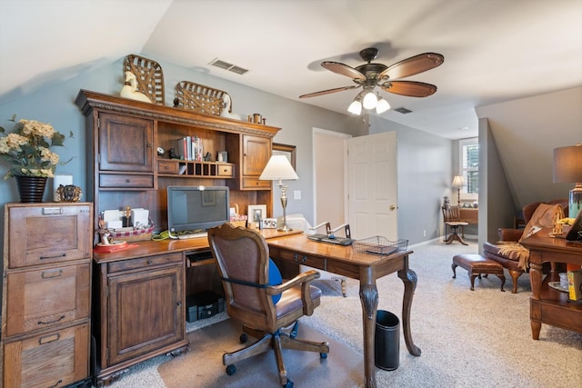 office space featuring ceiling fan, light colored carpet, and lofted ceiling