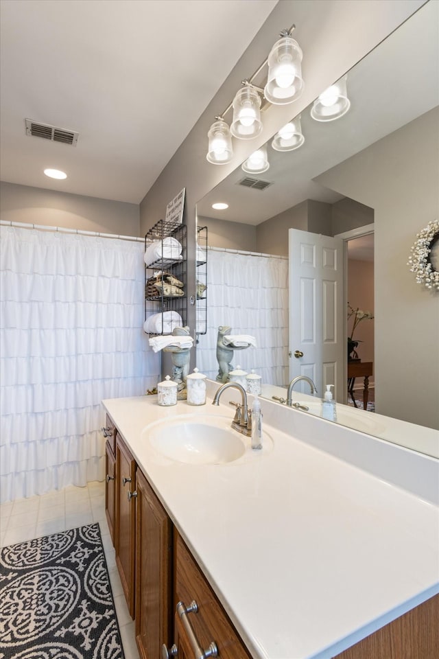 bathroom with tile patterned floors and vanity