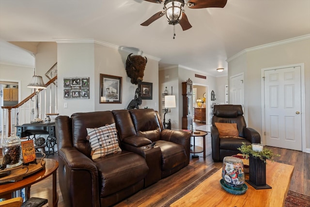 living room featuring ceiling fan, crown molding, and dark wood-type flooring