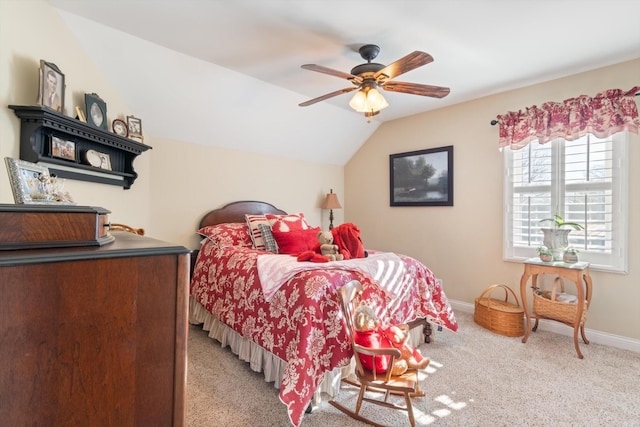 carpeted bedroom featuring ceiling fan and vaulted ceiling