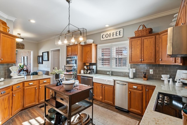 kitchen featuring sink, tasteful backsplash, dark hardwood / wood-style flooring, decorative light fixtures, and appliances with stainless steel finishes