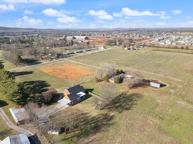 birds eye view of property with a rural view