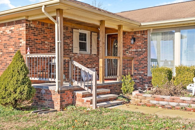 view of exterior entry featuring a porch