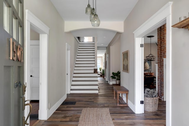 entryway with dark hardwood / wood-style floors