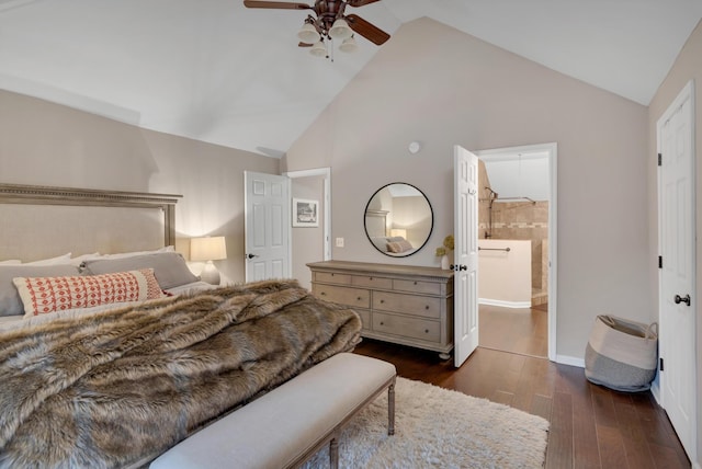 bedroom featuring connected bathroom, ceiling fan, dark hardwood / wood-style flooring, and vaulted ceiling