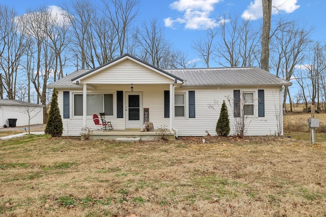 ranch-style home with a porch and a front lawn