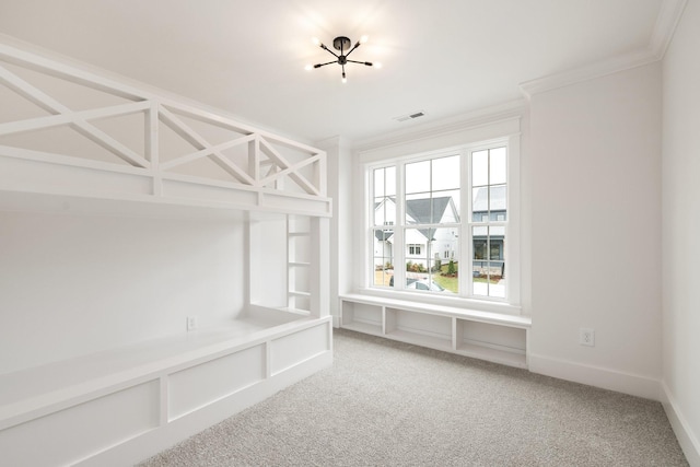 mudroom with carpet flooring and crown molding