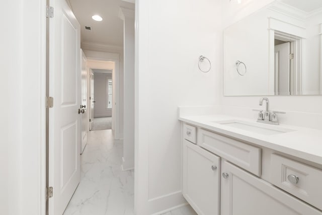 bathroom with vanity and crown molding