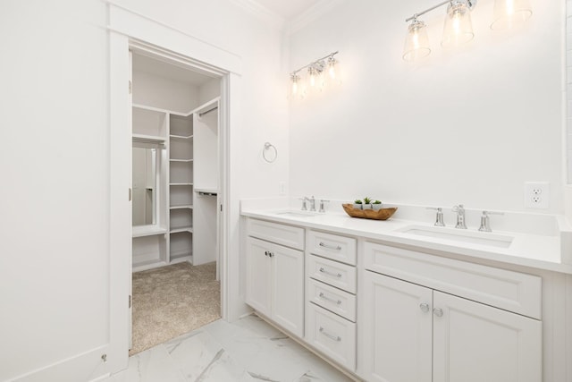 bathroom featuring crown molding and vanity