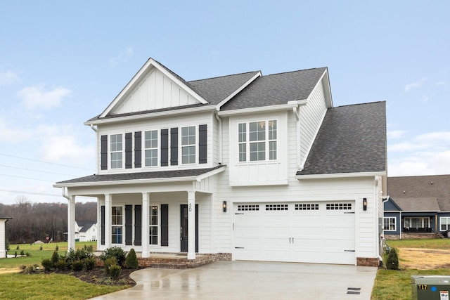 view of front of house with covered porch and a garage