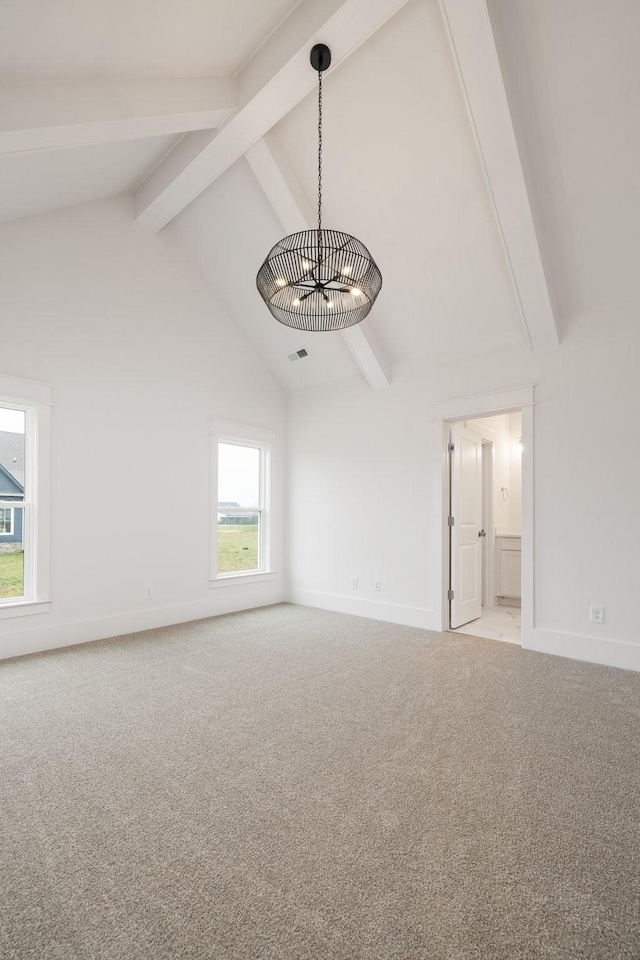 spare room featuring light carpet, beam ceiling, high vaulted ceiling, and a notable chandelier