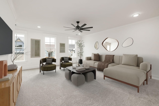 carpeted living room featuring ceiling fan and ornamental molding