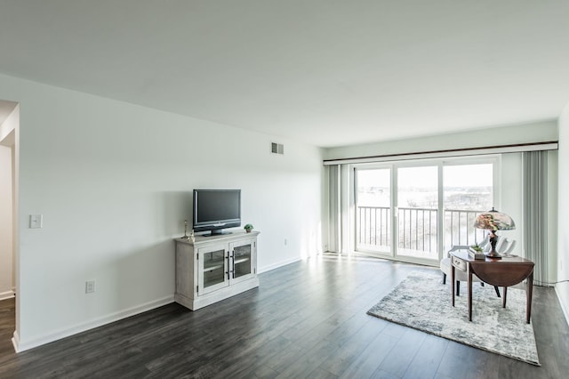 living room featuring dark hardwood / wood-style flooring