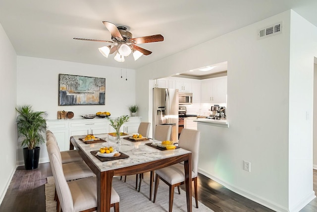 dining space featuring hardwood / wood-style flooring and ceiling fan