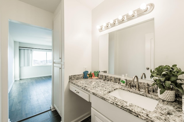 bathroom featuring vanity and hardwood / wood-style flooring