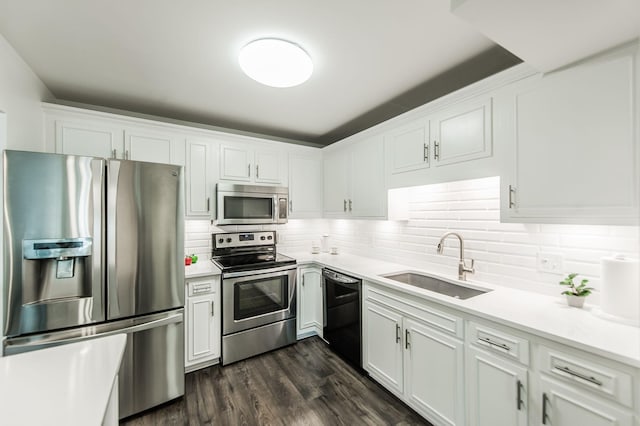 kitchen featuring white cabinets, appliances with stainless steel finishes, and sink