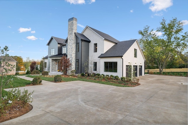 view of side of property with a garage