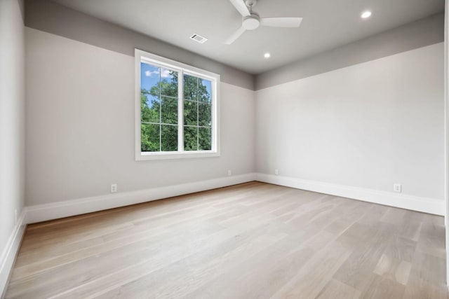 spare room featuring ceiling fan and light hardwood / wood-style flooring