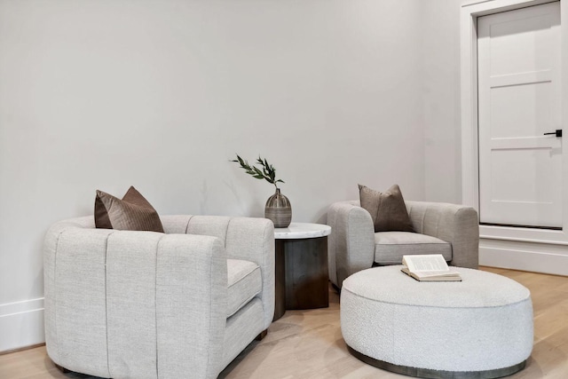 sitting room featuring light hardwood / wood-style floors