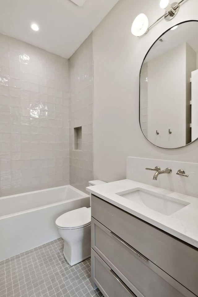 full bathroom with tile patterned floors, vanity,  shower combination, and toilet