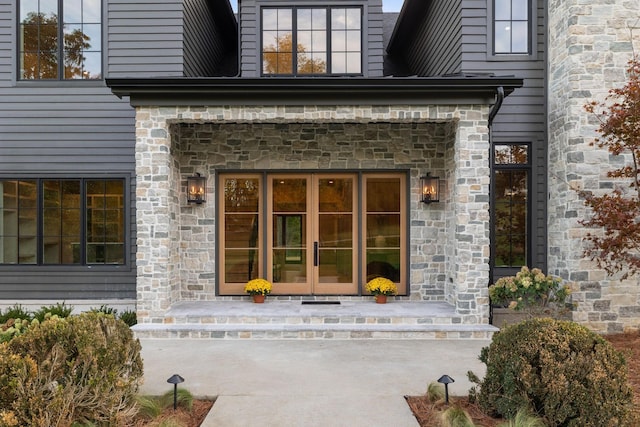 view of exterior entry featuring french doors