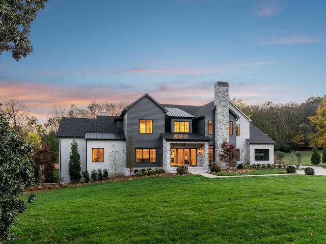 view of front of home with a yard