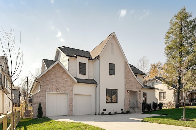 view of front of home with a front lawn and a garage