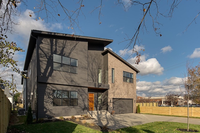 back of property with a lawn and a patio area