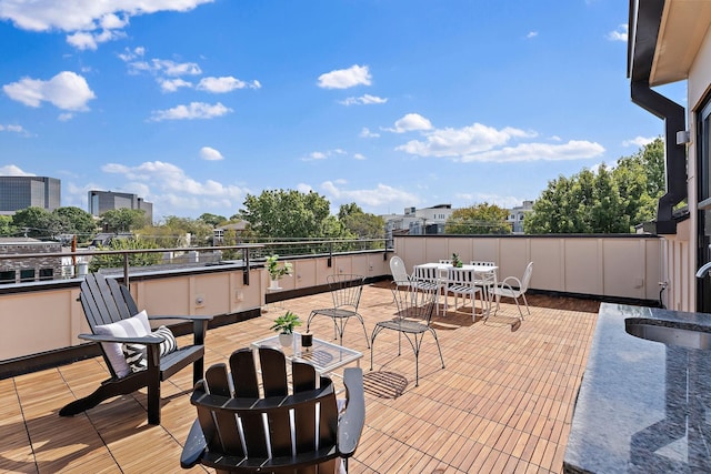 view of patio featuring a balcony and sink