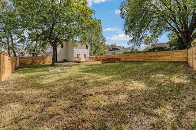 view of yard featuring a wooden deck