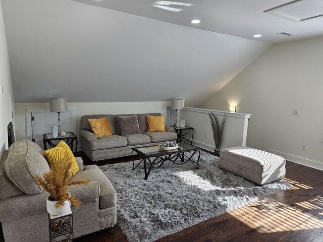 living room with lofted ceiling and dark hardwood / wood-style flooring