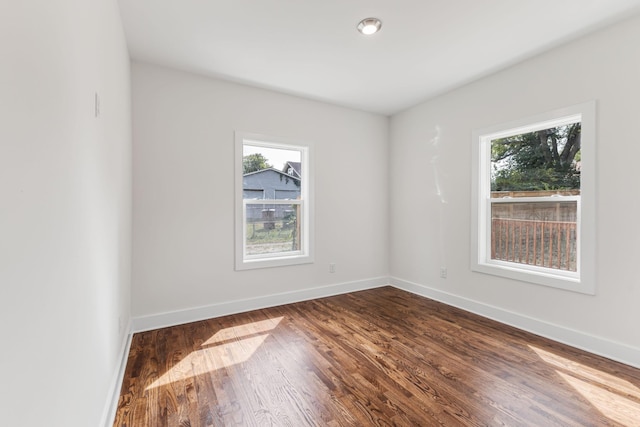 unfurnished room featuring hardwood / wood-style floors