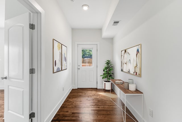 doorway to outside featuring dark hardwood / wood-style floors