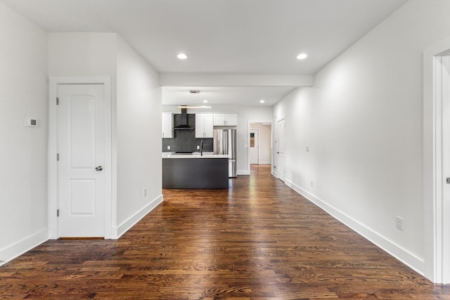 unfurnished living room featuring dark wood-type flooring