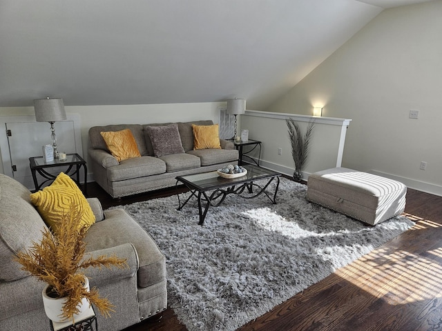 living room featuring vaulted ceiling and dark hardwood / wood-style floors