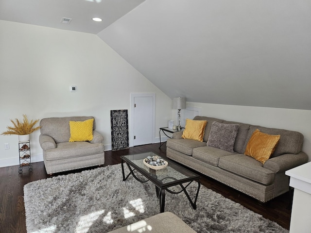 living room featuring lofted ceiling and dark hardwood / wood-style floors