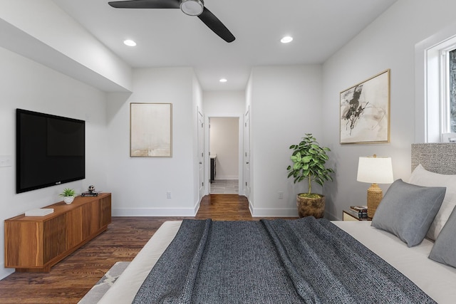 bedroom with dark wood-type flooring and ceiling fan