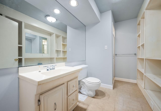 bathroom featuring vanity, toilet, and a shower with shower door