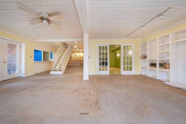 unfurnished living room featuring track lighting, ceiling fan, ornamental molding, and french doors