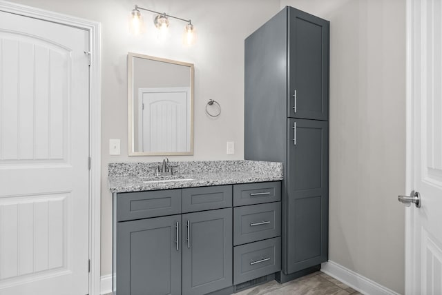 bathroom with tile patterned floors and vanity